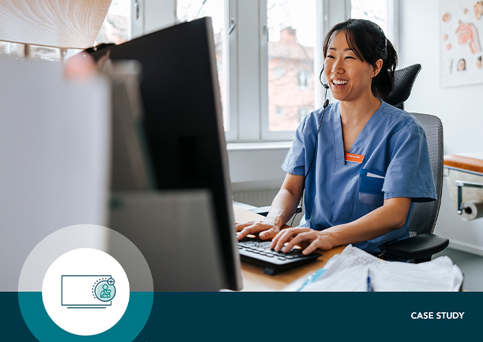A young Asian woman wearing light blue scrubs and a headset sits at a computer in her role as a virtual care nurse at The Christ Hospital, where SONIFI's integrations helped change the care delivery model